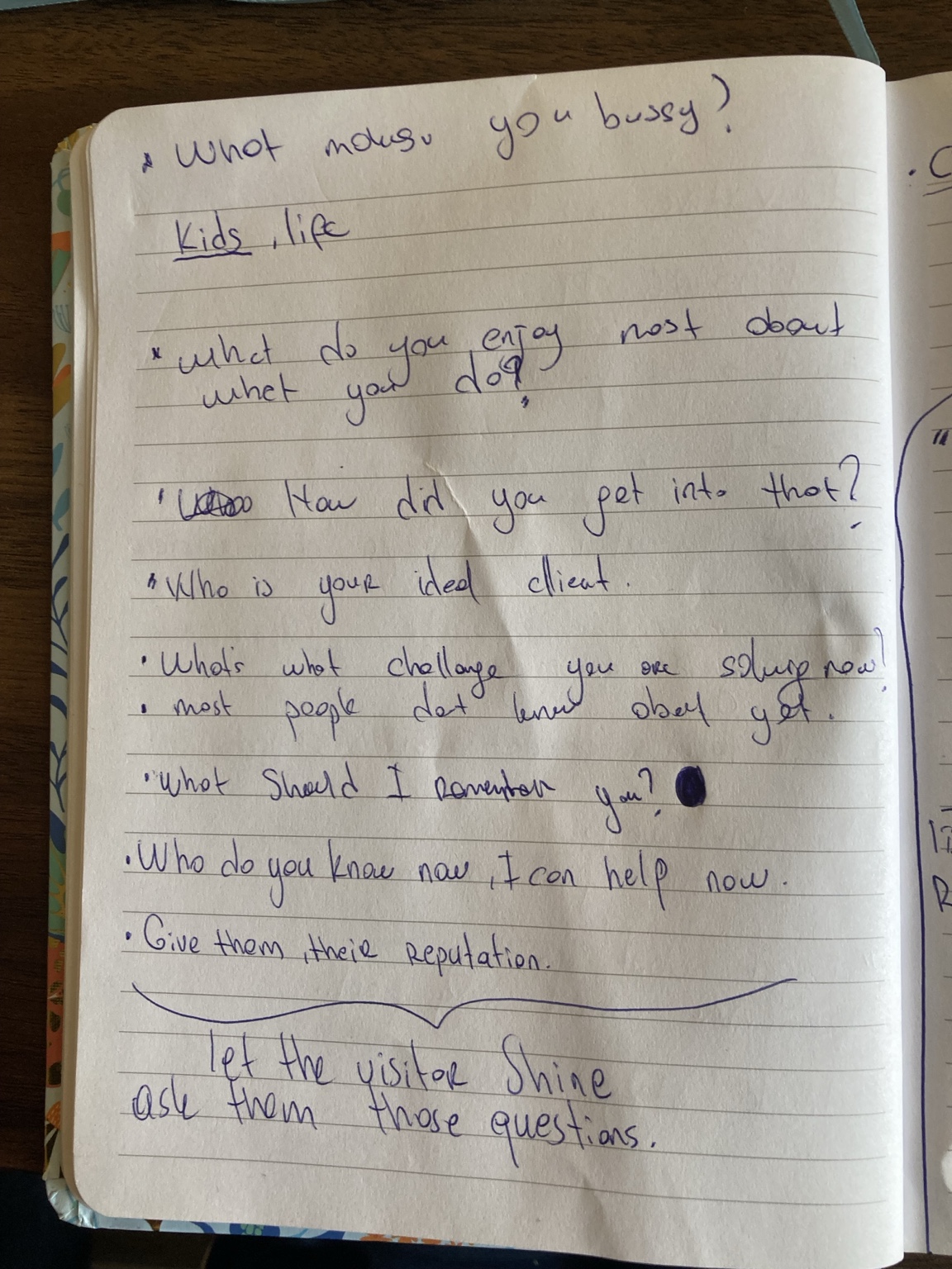 Handwritten notebook notes listing better opening questions for business conversations.